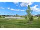 Enjoy community living near this serene pond with a charming fountain, park benches, and a walking path at 7184 Lillian Pl, Cumberland, IN 46229