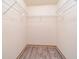 Empty closet features wire shelving for optimal storage solutions with neutral walls and modern vinyl flooring at 7545 Briarstone Dr, Indianapolis, IN 46227