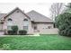 Charming brick home with well-maintained lawn and landscaping offering pleasant curb appeal at 7545 Briarstone Dr, Indianapolis, IN 46227
