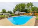 Inviting backyard pool, lounge chairs, a pergola, and a lush green lawn at 7935 N County Road 650 E, Brownsburg, IN 46112