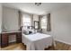 Well-lit bedroom boasts hardwood floors, a cozy bed, and dual windows with light-blocking curtains at 7935 N County Road 650 E, Brownsburg, IN 46112