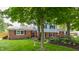 Charming two-story home featuring a blend of brick and siding, complemented by mature trees and lush landscaping at 7935 N County Road 650 E, Brownsburg, IN 46112