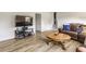 Comfortable living room with a television, wood accents, and hardwood floors, great for entertaining at 7935 N County Road 650 E, Brownsburg, IN 46112