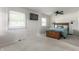 Comfortable main bedroom featuring carpet, natural light, and closet space, providing a relaxing environment at 7935 N County Road 650 E, Brownsburg, IN 46112