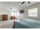 Spacious main bedroom with neutral walls, two windows, and ceiling fan at 7935 N County Road 650 E, Brownsburg, IN 46112