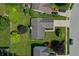 An aerial view of the property featuring a well-maintained lawn and mature trees at 7942 Dillon Pl, Indianapolis, IN 46236