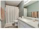 Neutral bathroom featuring a shower with curtain and gray countertop at 7942 Dillon Pl, Indianapolis, IN 46236