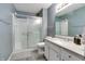 Modern bathroom with tiled floors, shower and updated vanity at 7942 Dillon Pl, Indianapolis, IN 46236