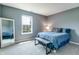 Inviting bedroom with large window, bench and a full length mirror at 7942 Dillon Pl, Indianapolis, IN 46236