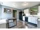 Well-lit kitchen features white cabinets, black appliances, and a gray countertop at 7942 Dillon Pl, Indianapolis, IN 46236
