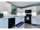 Charming kitchen features white subway tile backsplash, updated appliances and ample cabinet space at 7942 Dillon Pl, Indianapolis, IN 46236