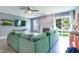 Cozy living room featuring a fireplace, sliding glass doors to the backyard and modern furniture at 7942 Dillon Pl, Indianapolis, IN 46236