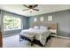 Comfortable main bedroom filled with natural light and carpet floors at 7942 Dillon Pl, Indianapolis, IN 46236