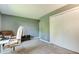 A functional office space featuring a storage closet and a comfortable chair with a workspace at 7942 Dillon Pl, Indianapolis, IN 46236