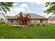 Well-maintained backyard with lush green grass and mature landscaping at 842 Cheltenham Way, Avon, IN 46123