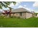 Brick home's spacious backyard with manicured lawn and landscaping at 842 Cheltenham Way, Avon, IN 46123