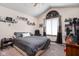 Cozy bedroom with a vaulted ceiling, large window and personal touches at 842 Cheltenham Way, Avon, IN 46123