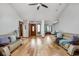 Open living room with hardwood floors, neutral walls, and modern furnishings at 842 Cheltenham Way, Avon, IN 46123