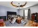 Main bedroom with a decorative ceiling and a large bed that fills the space at 842 Cheltenham Way, Avon, IN 46123