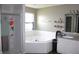 Bathroom featuring a soaking tub, shower and white vanity with a grey countertop at 8519 Frosty Rose Dr, Avon, IN 46123