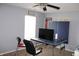 This bedroom is equipped with a ceiling fan, natural light from the window, and an adaptable ping pong table at 8519 Frosty Rose Dr, Avon, IN 46123