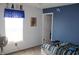 Inviting bedroom with neutral walls complemented by a pop of color with a blue accent wall at 8519 Frosty Rose Dr, Avon, IN 46123