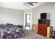 Bedroom featuring a bed with patterned comforter, dresser and views to bathroom at 8519 Frosty Rose Dr, Avon, IN 46123