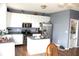 Functional kitchen featuring white cabinetry, stainless steel appliances, and an island with a view to laundry room at 8519 Frosty Rose Dr, Avon, IN 46123