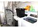 Laundry room featuring modern washer and dryer with cleaning supplies and utility equipment at 8519 Frosty Rose Dr, Avon, IN 46123