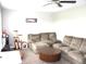 Living room with neutral walls, a large sectional couch, and tables at 8519 Frosty Rose Dr, Avon, IN 46123