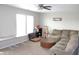 Living room with neutral walls, a large sectional couch, and tables at 8519 Frosty Rose Dr, Avon, IN 46123
