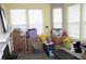 Bright sunroom filled with boxes and storage containers, illuminated by natural light at 8519 Frosty Rose Dr, Avon, IN 46123