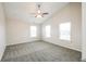 Inviting bedroom with vaulted ceilings, a ceiling fan, and three bright windows at 9220 Crossing Dr, Fishers, IN 46037