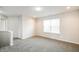 Cozy carpeted bonus room with natural light, offering a comfortable space for relaxation at 9220 Crossing Dr, Fishers, IN 46037