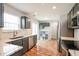 Modern kitchen featuring stainless steel appliances, gray cabinets and a breakfast area at 9220 Crossing Dr, Fishers, IN 46037