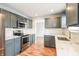 Stylish kitchen with stainless steel appliances, sleek countertops, and ample cabinet space at 9220 Crossing Dr, Fishers, IN 46037