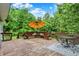 Spacious back deck with outdoor seating and umbrella at 9302 Budd Run Dr, Indianapolis, IN 46250