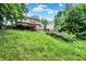 Expansive backyard features a deck, lush greenery, and privacy fence for outdoor enjoyment at 9302 Budd Run Dr, Indianapolis, IN 46250
