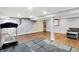 Basement featuring hard wood floors, a workout area, a fireplace, and a staircase at 9302 Budd Run Dr, Indianapolis, IN 46250