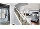 Finished basement with a staircase, gym, wood-look flooring, and access to the laundry room at 9302 Budd Run Dr, Indianapolis, IN 46250