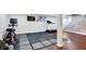 Finished basement exercise area with hardwood floors and a workout space at 9302 Budd Run Dr, Indianapolis, IN 46250