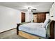 Bedroom showcasing a barn door, a ceiling fan, and calm atmosphere at 9302 Budd Run Dr, Indianapolis, IN 46250