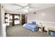 Bedroom featuring neutral carpet, a ceiling fan, and a closet with hanging storage at 9302 Budd Run Dr, Indianapolis, IN 46250