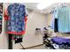 This walk in closet features lots of hanging space, wire shelves, and a variety of clothing at 9302 Budd Run Dr, Indianapolis, IN 46250
