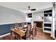 Classic dining room with a brick fireplace, built-in shelving, and a lovely table set for an intimate gathering at 9302 Budd Run Dr, Indianapolis, IN 46250