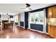 Open concept kitchen area with adjoining dining space featuring wood floors, a fireplace, and large bright windows at 9302 Budd Run Dr, Indianapolis, IN 46250