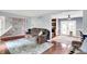 Spacious living room with hardwood floors, a neutral color scheme, and open access to other areas at 9302 Budd Run Dr, Indianapolis, IN 46250
