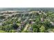 Aerial view of a neighborhood featuring tree-lined streets with mix of residential and industrial buildings at 938 N Tuxedo St, Indianapolis, IN 46201