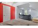 Bedroom featuring a gray sofa sectional and an open doorway into another space of the room at 938 N Tuxedo St, Indianapolis, IN 46201