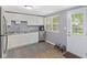 Well-equipped kitchen with stainless steel appliances, ample counter space, and abundant natural light at 938 N Tuxedo St, Indianapolis, IN 46201